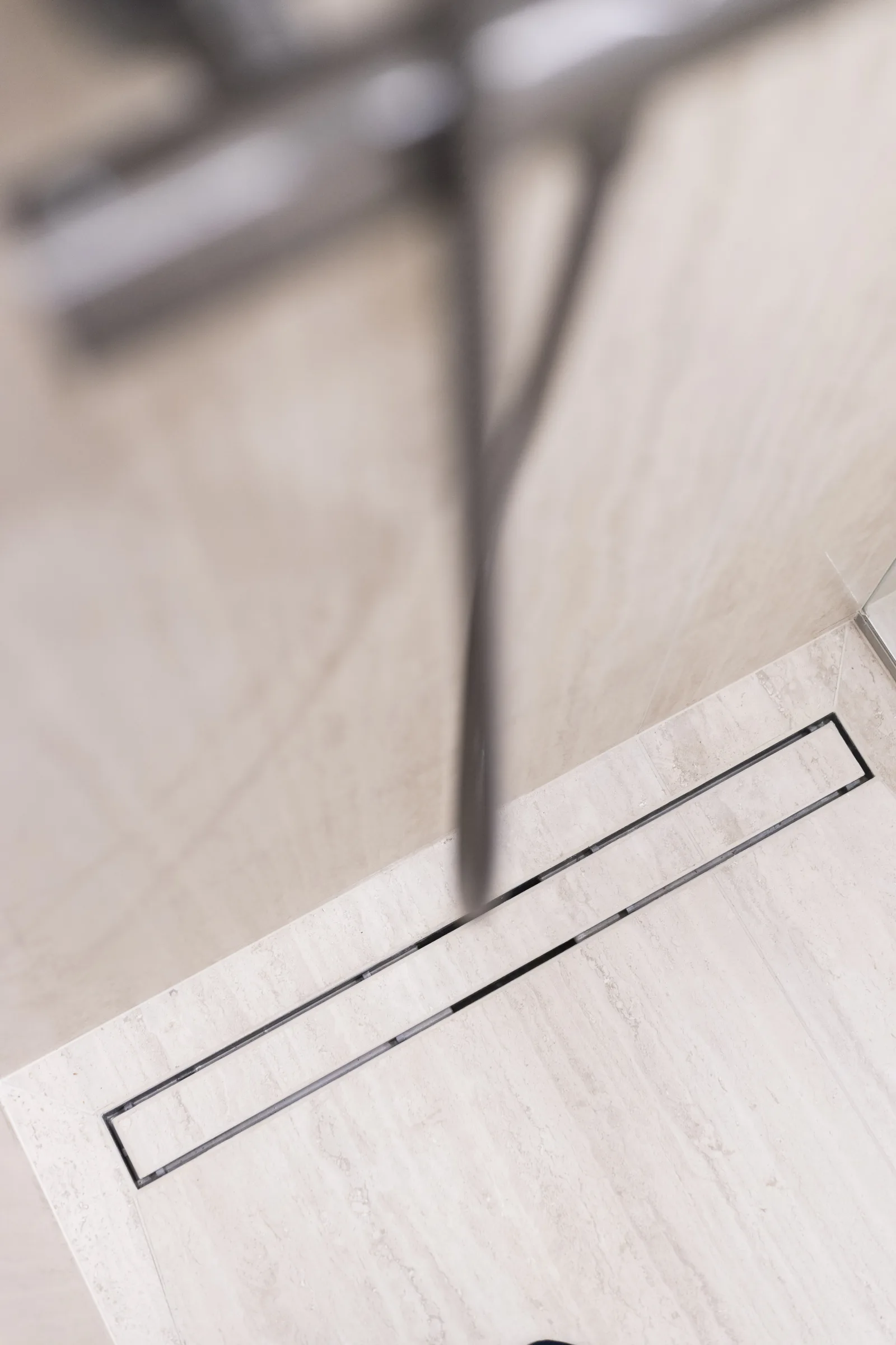 Drain integrated into the floor tiles
