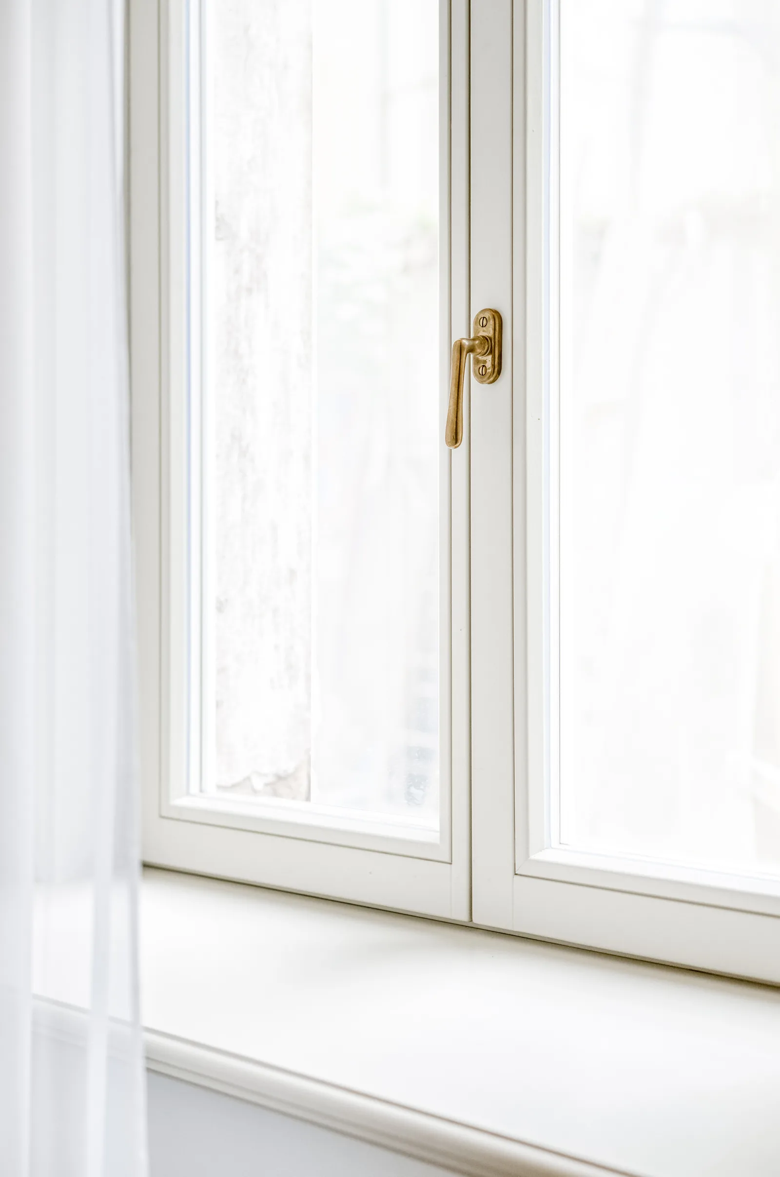Box-type window with brass hardware